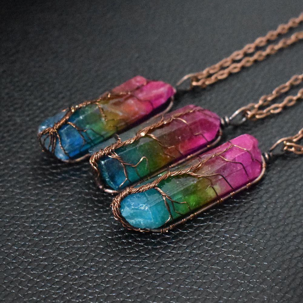 Stone Crystal Pillar Tree of Life Pendant Necklace with rainbow accents on an O-chain, symbolizing growth and harmony.